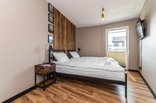 Postel nebo postele na pokoji v ubytování Jantar Resort Flatbook - Wynajem Apartamentów nad Morzem