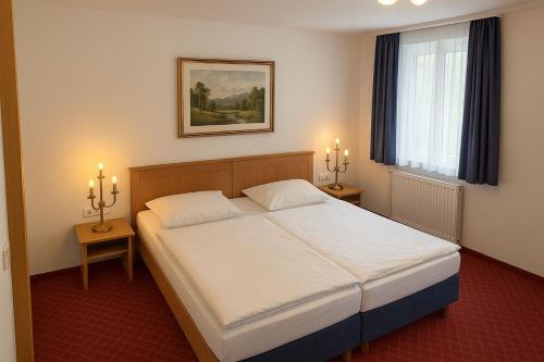 Postel nebo postele na pokoji v ubytování Hotel Schillerplatz