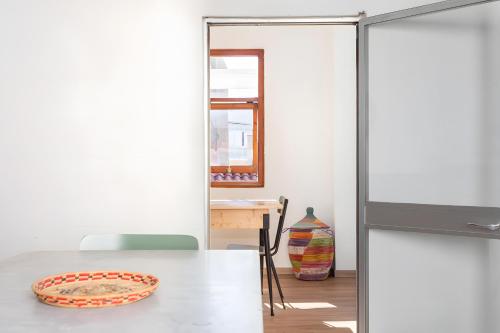 a dining room with a table with a plate on it at Domo Mea - La Tua Casa In Sardegna in Cuglieri