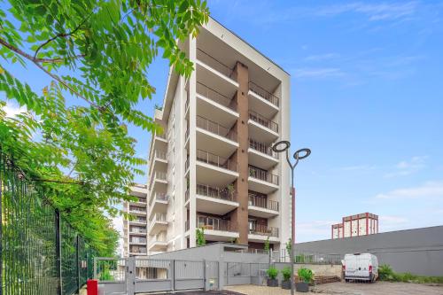 an image of an apartment building at Airy Apartments with Balcony & Garage in Milan