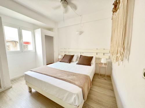 Postel nebo postele na pokoji v ubytování Apartamentos Formentera Copacabana 18
