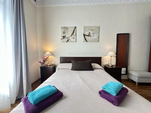 Postel nebo postele na pokoji v ubytování Rooms Aribau