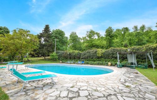 an image of a swimming pool in a yard at Cozy Apartment In Croce Di Castiglione in San Secondo