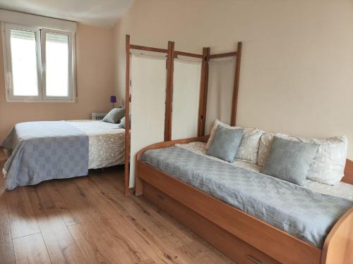 Ein Bett oder Betten in einem Zimmer der Unterkunft El Sendero