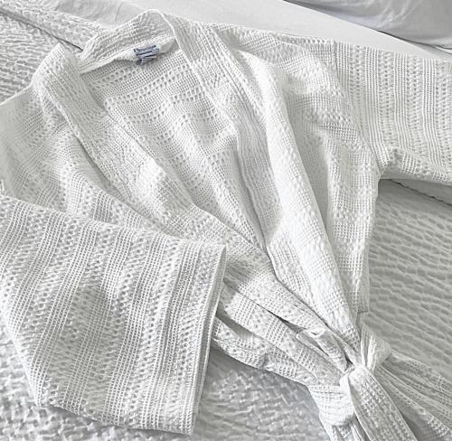 a white shirt laying on top of a bed at Holiday Inn Resort Kissimmee by the Parks by IHG in Orlando