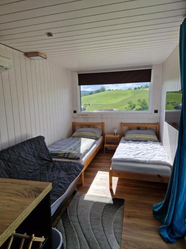 Postel nebo postele na pokoji v ubytování AktivQuartier Mühlviertel Tiny House