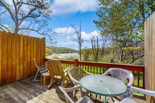 a deck with a table and chairs and a fence at Ski Cove #2 in McHenry