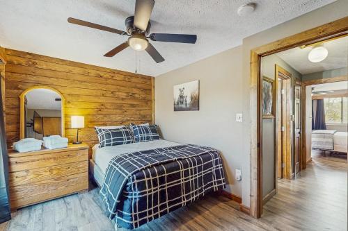 a bedroom with a bed and a ceiling fan at Ski Cove #2 in McHenry