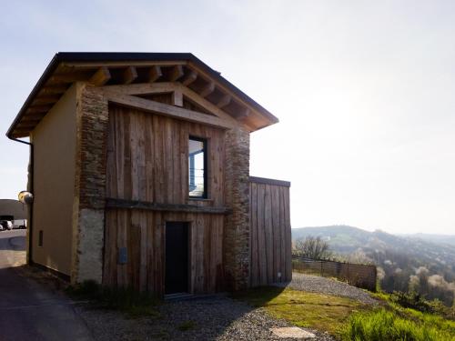 a small building on top of a hill at Il portiot di Langa - Ijan Ospitalità di Borgata in Igliano