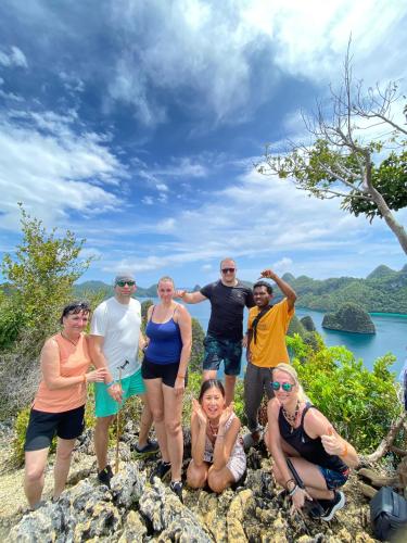 a group of people standing on top of a mountain at Fam Homestay in Fam