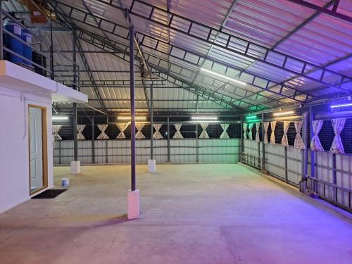 an empty garage with a pole in the middle of it at Roadway Inn in Kattappana