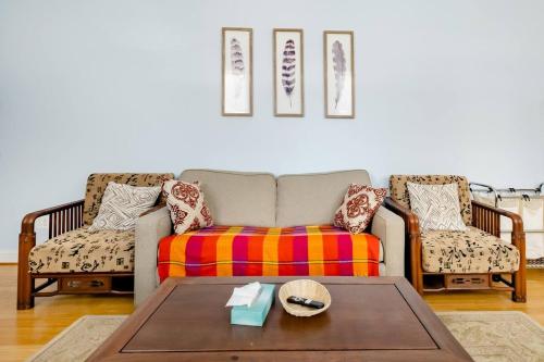 a living room with a couch and two chairs at 501 Lovely Bmore Inner Harbor Suite! in Baltimore