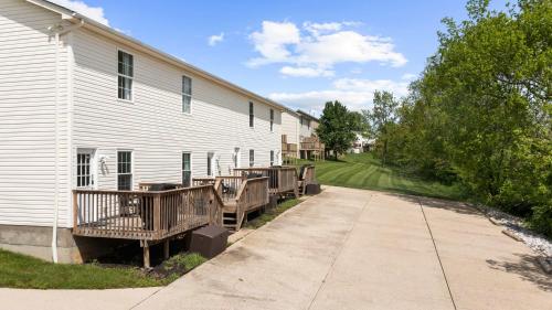 a building with wooden decks next to a building at Lovely 3br Apartment for 7 - Near Ark Encounter in Williamstown