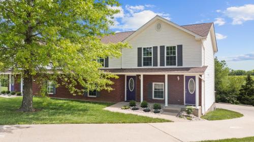 a house with a tree in front of it at Lovely 3br Apartment for 7 - Near Ark Encounter in Williamstown