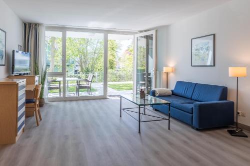 TV a/nebo společenská místnost v ubytování Ferienwohnung Seebär an der Seebrücke Zingst - ruhig gelegen mit Terrasse