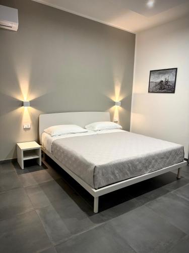 Una cama o camas en una habitación de MP Rooms