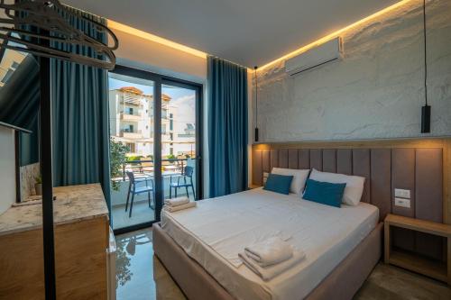 Postel nebo postele na pokoji v ubytování Monel Hotel