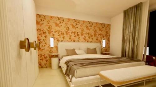 a bedroom with a large bed in a room at Hotel Punta Tragara in Capri
