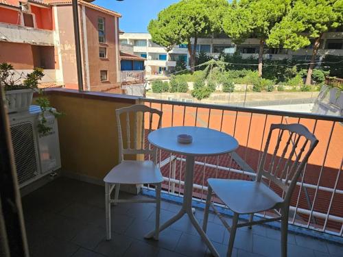 a table and two chairs on a balcony at Blue Tide - Tropea in Tropea