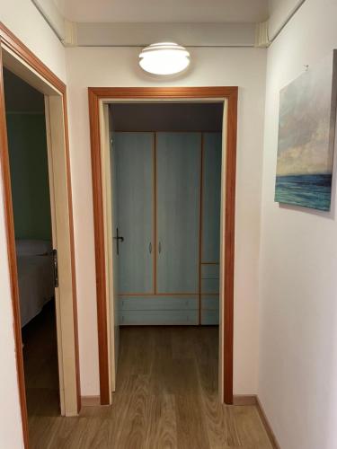 an empty room with a closet and a light at Hotel Barbiani in Riccione