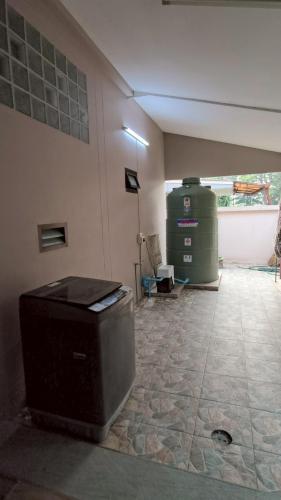 a room with a tv sitting on the floor at Private 2-storey house in Chiang Mai By The Orchard in Chiang Mai