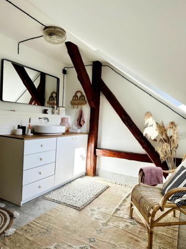 a bathroom with a sink and a mirror at Za Lasem Nad Wodą in Narty