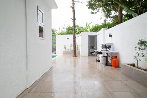 an empty hallway of a house with white walls at 2BR, Private Pool, Modern, Close to Beach in Las Terrenas