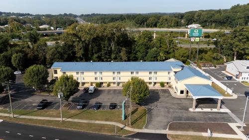 an overhead view of a building with a blue roof at Quality Inn & Suites Danbury near University in Danbury