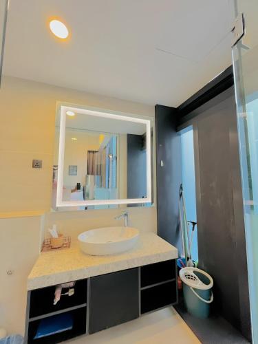 a bathroom with a sink and a mirror at Suites Apartment By Star Residences in Kuala Lumpur