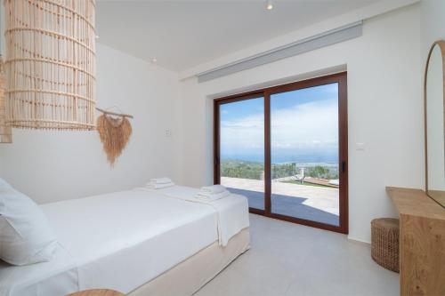 Katil atau katil-katil dalam bilik di Anemones Villas by Omikron Selections