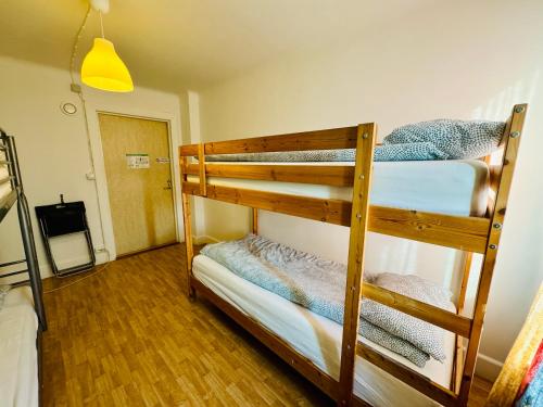 a couple of bunk beds in a room at Hässlebogården Turist & Konferens in Mariannelund