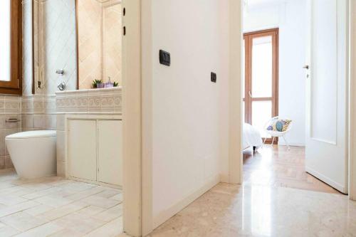 a bathroom with a sink and a toilet in a room at Oasi di Famagosta Milano Navigli in Milan