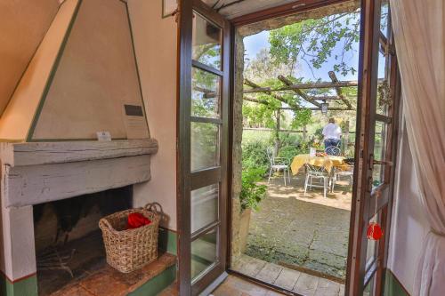 a room with a glass door leading to a patio at Agriturismo La Cervaiola Piccola dimora di Campagna in Porano