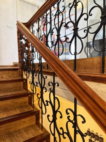 a set of stairs with wrought iron railing at Casa Rosetta Boutique in Xàtiva