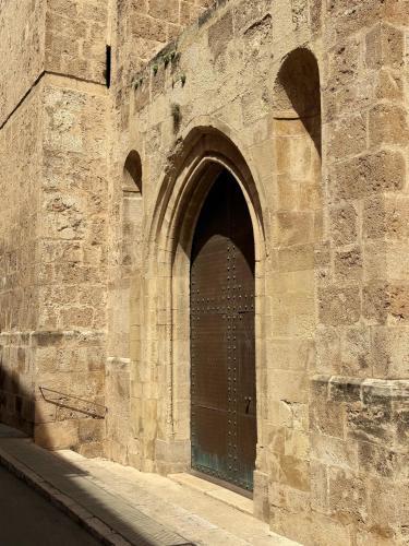a brick wall with a door in a building at Casa Rosetta Boutique in Xàtiva