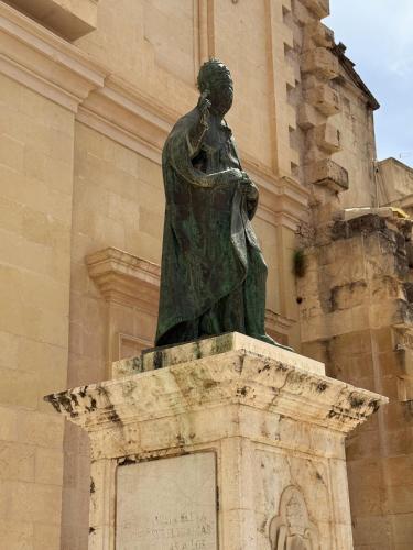 a statue of a woman on top of a building at Casa Rosetta Boutique in Xàtiva