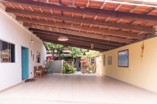 an open patio with awning in a house at Pousada Jubartti in Prado