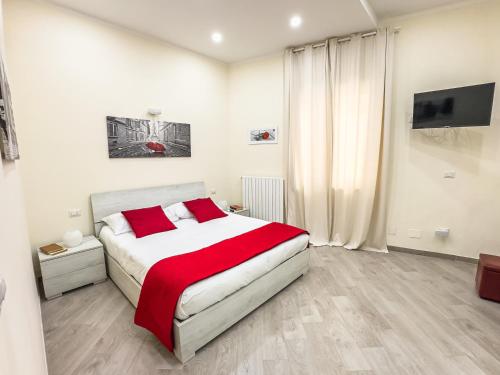 Ένα ή περισσότερα κρεβάτια σε δωμάτιο στο Danyshome Minerva al Mare in pieno Centro