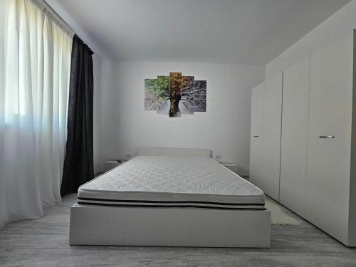 Ένα ή περισσότερα κρεβάτια σε δωμάτιο στο Apartament Residence