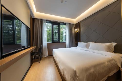 Voodi või voodid majutusasutuse 万仕达酒店Vanisdar Hotel toas