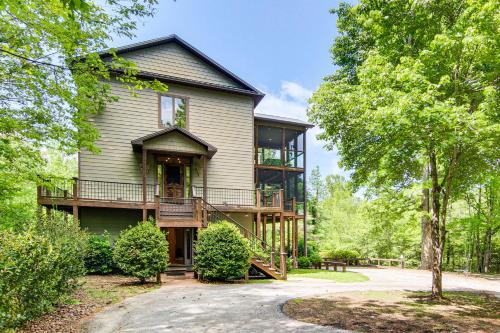 a large house with a porch and a balcony at Hot Tub and Trail Access Treehouse in Landrum! in Landrum