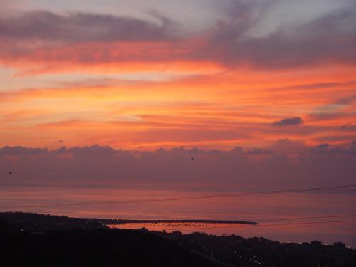 a sunset over a body of water at Giardino Di Sicilia in SantʼAgata di Militello
