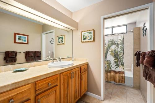 a bathroom with a sink and a shower at Big Island Keauhou Punahele B108 by Coldwell Banker Island Vacations in Kailua-Kona