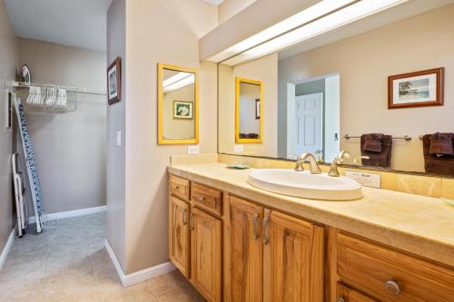a bathroom with a sink and a mirror at Big Island Keauhou Punahele B108 by Coldwell Banker Island Vacations in Kailua-Kona