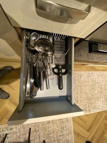 a kitchen utensil rack in a drawer under a sink at THE ANNEXs in Bray