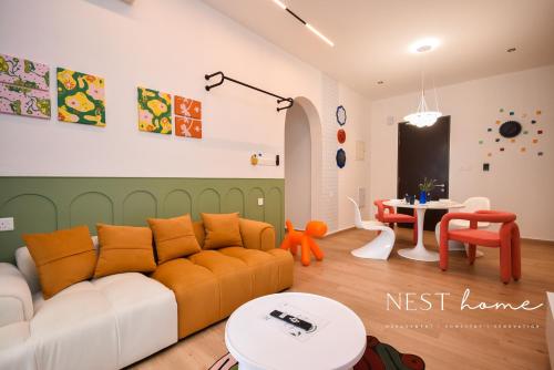 a living room with a couch and a table at Country Garden Seaview Suite by Nest Home at Danga Bay in Johor Bahru