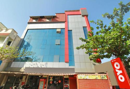 a tall building with red and white tiles on it at Hotel O India Gate in Chennai