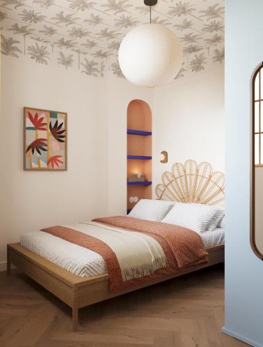a bedroom with a bed and a ceiling with plants at Sea You Sun in Rogowo