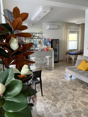 a living room with a couch and a table at Hotel Barbiani in Riccione