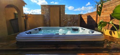 a jacuzzi tub sitting on a patio at Maison Casa Milesa - SPA, calme, 12 min mer, parking securisé in Nice